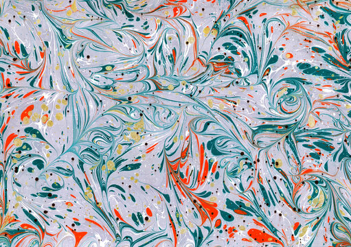 Original handmade Turkish ebru marbling art, abstract swirl pattern in teal, coral orange and gold on lavender.