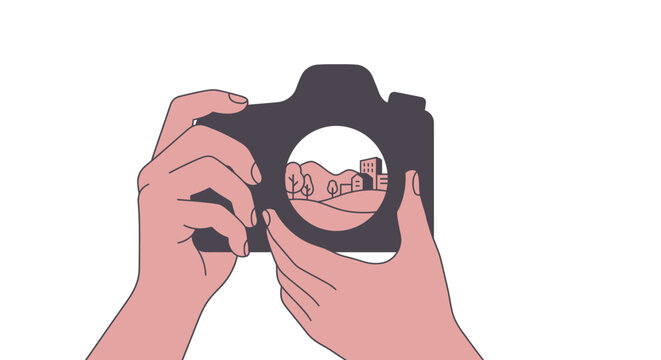 Hands holding camera taking landscape photo.