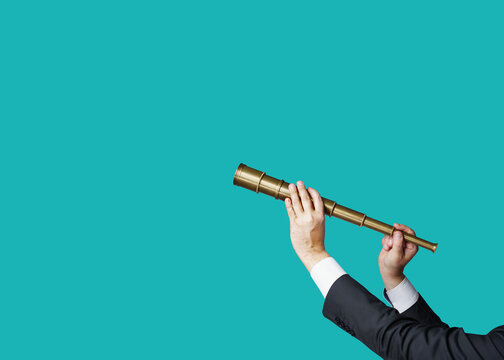 Hands in business attire hold a pirate telescope, isolated against a flat-design background. Business analytics and strategic thinking.