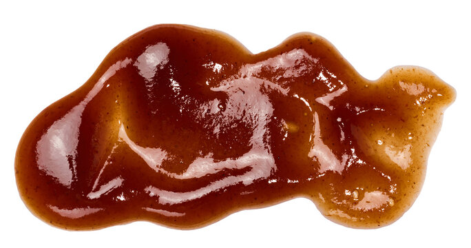 Textured smear of dark red barbecue sauce in wave shape on isolated background