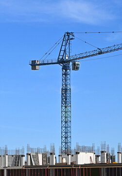 Tall crane and framework on construction