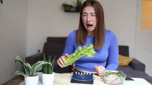 Young woman forces herself to eat bitter celery just to reach her daily fiber goal showing obsessive nutrition tracking calorie counting and strict healthy diet