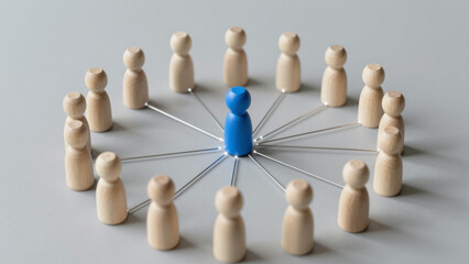 Obraz premium Blue Leader Figurine at Center of Connected Team Circle – Minimalist Business Concept for Leadership, Collaboration, and Network Management Presentations