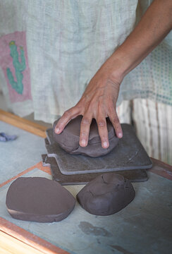 Potter holding clay 