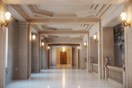 Elegant architectural details inside San Francisco City Hall, featuring ornate Beaux-Arts design, decorative columns, marble surfaces, intricate craftsmanship, and historic civic architecture.