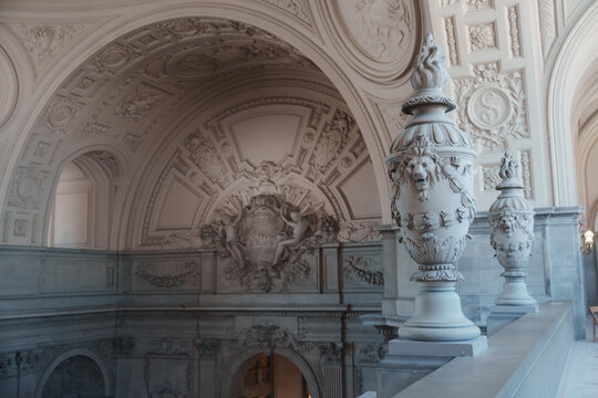 Elegant architectural details inside San Francisco City Hall, featuring ornate Beaux-Arts design, decorative columns, marble surfaces, intricate craftsmanship, and historic civic architecture.