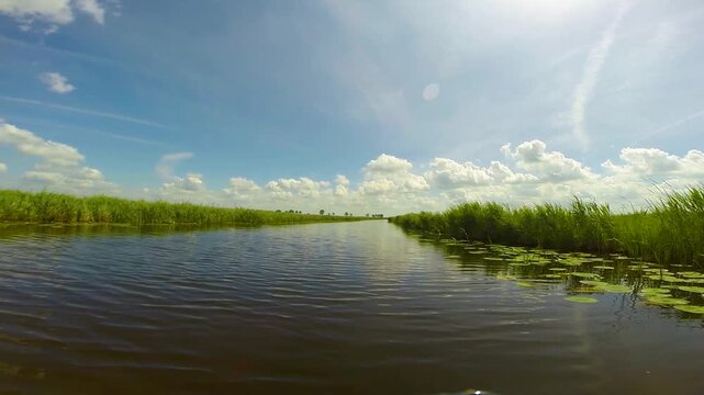 Point of view of a boat boat cruising through Dutch channels, Netherlands
