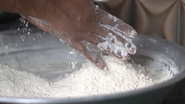 Chef Hands Mixing White Flour Maida in Large Steel Bowl for Baking. Man Hands Kneading White Wheat Powder Maida in Big Metal Plate.