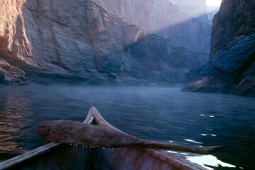 Fototapeta premium Canoe paddle resting over gunwale in narrow desert canyon
