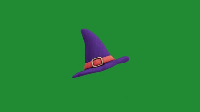 Purple witch hat with golden buckle and stars sparkle on green screen, halloween magic wizard hat chroma key