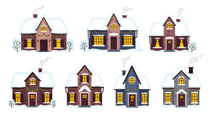 Naklejka premium Charming collection of various cozy winter houses with snow-covered roofs and glowing windows against a white background.