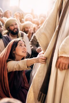 Dynamic Moment: Woman Reaching Through Crowd to Touch Jesus' Robe for Healing