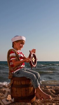 A happy child is having fun during summer vacation. The concept of dreams and travel. Vertical video, Slow motion