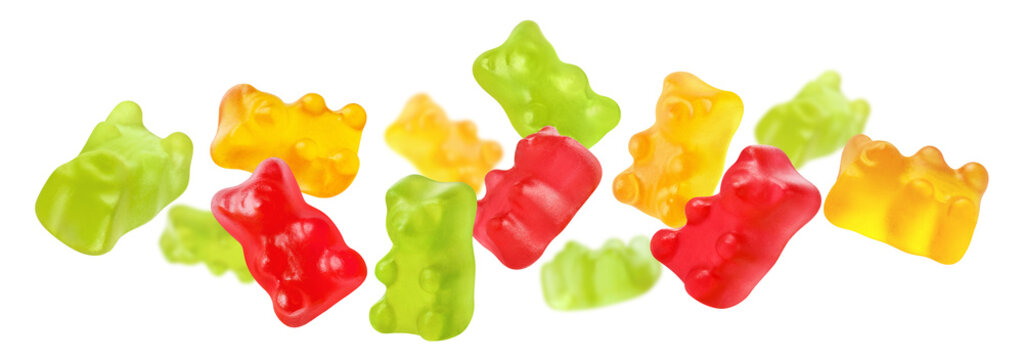 Colorful gummy bears floating in air, isolated on transparent cutout background