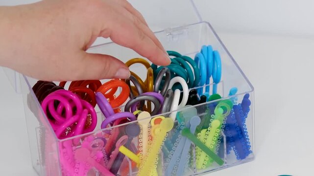 Orthodontic elastics organizer with colorful dental ligatures and separators for braces treatment