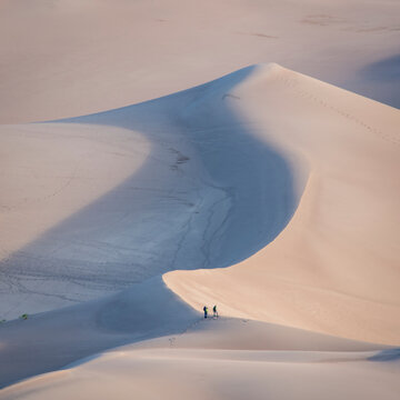 hikers and photographers at sunrise - Great Sand Dunes National Park and Preserve in Colorado