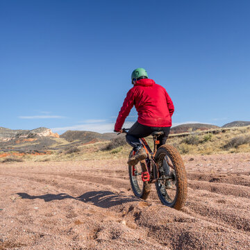 riding a fat bike on mountain desert trail in Red Mountain Open Space in northern Colorado, late fall scenery
