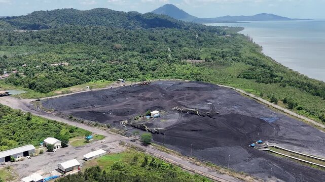 Coal is stockpiled and transported at the waterfront in Kotabaru, South Kalimantan
