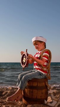 A happy child is having fun during summer vacation. The concept of dreams and travel. Vertical video. Slow motion