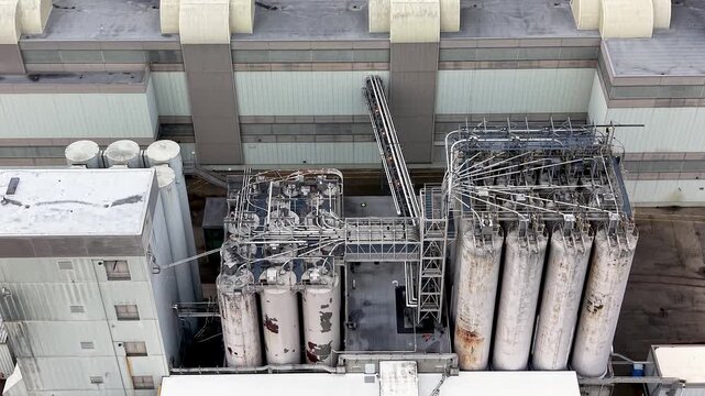 Industrial factory complex and grain elevators aerial view