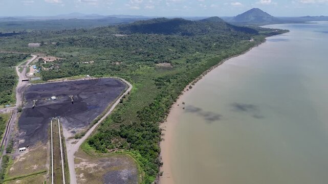 Coal is stockpiled and transported at the waterfront in Kotabaru, South Kalimantan