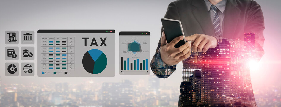 A business professional interacts with a smartphone while analyzing tax-related data, surrounded by financial graphics and a city skyline at dusk, representing modern finance. Ledger