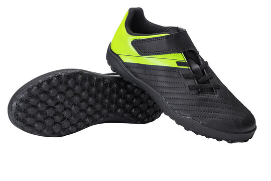 Black and neon yellow turf soccer shoes isolated on white background