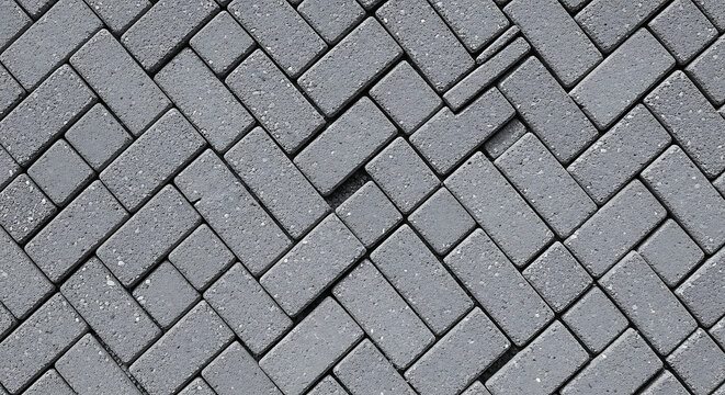 Detailed herringbone paving texture with gray concrete blocks for architectural background