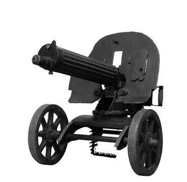 Vintage black Maxim machine gun from World War I, featuring long water-cooled barrel and large wheels. Isolated on transparent background.