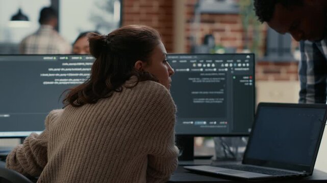 Database developer reacts to a compiling problem during algorithm work, reviewing code results and troubleshooting an issue at the workstation