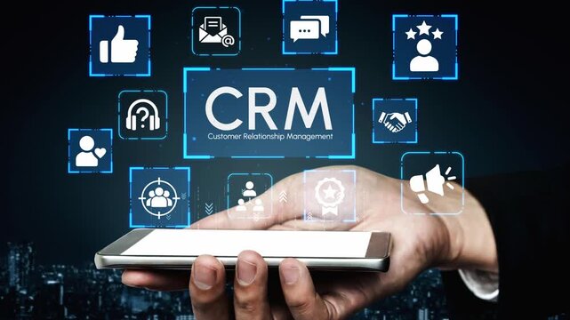 Modern Hand Holding Smartphone with CRM Icons Above for Customer Relationship Management and Digital Marketing Solutions in Urban Setting. Entropy.