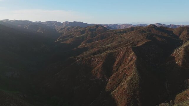 Epic sunset aerial of the chaparral landscape of Topanga state park in the Santa Monica mountains, a popular travel destination with hiking trails and scenic pacific coast views, but prone to wildfire