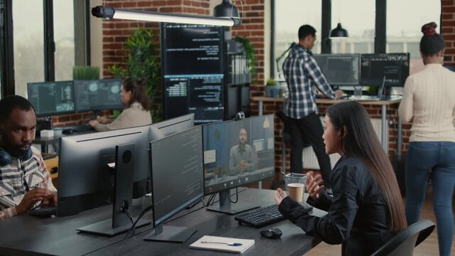 Software developer speaks with a client team on a remote call about a development project, connecting client communication, code planning and online teamwork