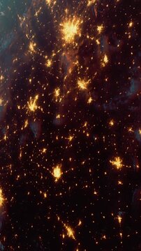 The Earth at night with bright clusters of city lights scattered across the surface. Dark areas contrast with the illumination. It captures urban areas and nature.