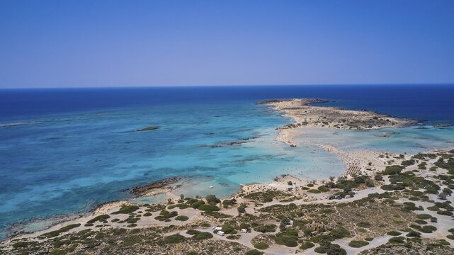 Overtourism, tourists on the beach, parasols, A sandy coast with turquoise sea, a popular nature holiday destination, Elafonissi, lagoon, south-western tip of Crete, Crete, Greek islands, Greece