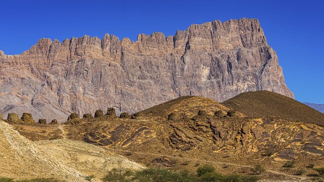 Round tombs made of unhewn stones, beehive tombs, behind the Jebel Misht mountain range, near the town of Al Ayn, Arabian Peninsula, Sultanate of Oman