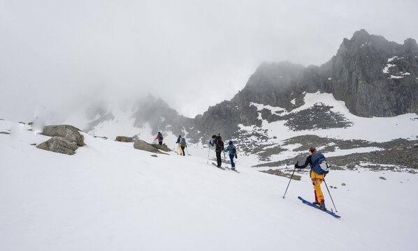Ski tourers in winter, fog in the mountains, Oberbergtal, Neustift im Stubai Valley, Tyrol, Austria