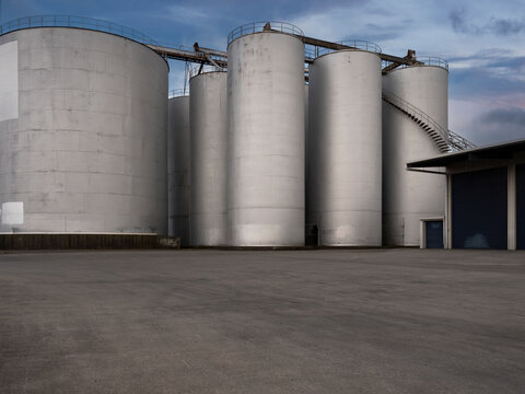 Car background, automotive backplate, industrial storage silos for oil, fuel, grain.
