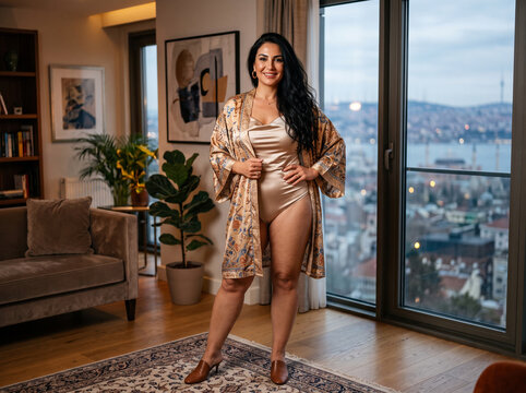 Woman standing in modern living room.