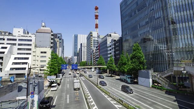 A timelapse of traffic jam at the urban city street in Tokyo wide shot zoom