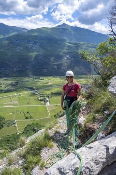 Climber on the rope, multi-pitch climbing, Via la Bellezza della Venere climbing tour, Garda Mountains, Arco, Trentino-Alto Adige, Italy