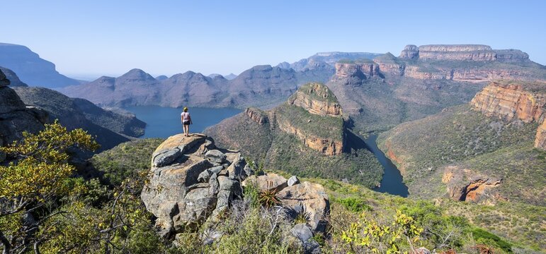 Hiker enjoying panorama, Blyde River Canyon with summit Three Rondawels, view of canyon with river Blyde River and table mountains, canyon landscape, Panorama Route, Mpumalanga, South Africa
