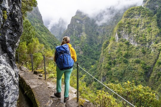 Hiker on a Levada, PR9 Levada do Caldeir&atilde;o Verde, Madeira, Portugal