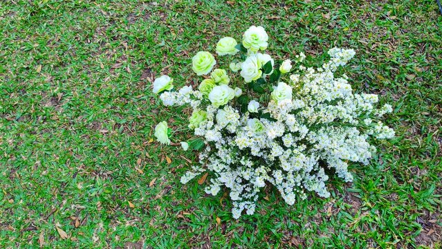Elegant White Wedding Floral Decoration on Green Lawn with Copy Space for Romantic Event Background