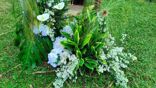 Elegant White Wedding Floral Decoration on Green Lawn with Copy Space for Romantic Event Background