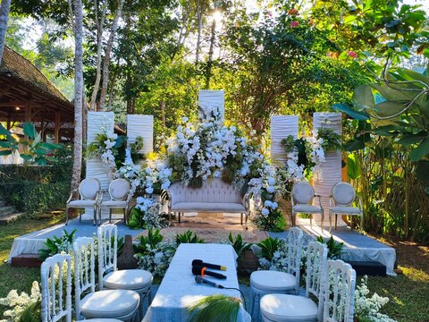 Elegant Nature Wedding Stage with White Floral Decoration and Luxury Bridal Sofa Outdoor Reception