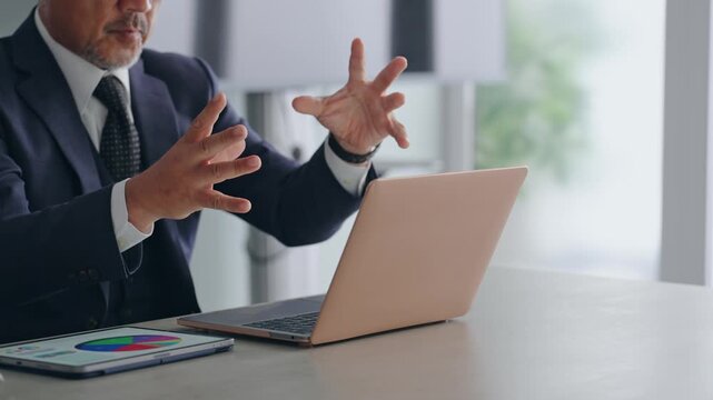 A male business professional interacting with a screen in mid-air. VR, virtual, hologram, operation, IT, visuals, screen, DX.