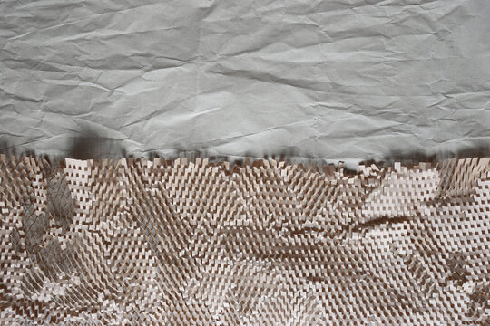 Honeycomb paper wrap and wrinkled kraft paper background, sustainable packaging material with copy space for text, eco-friendly delivery concept.