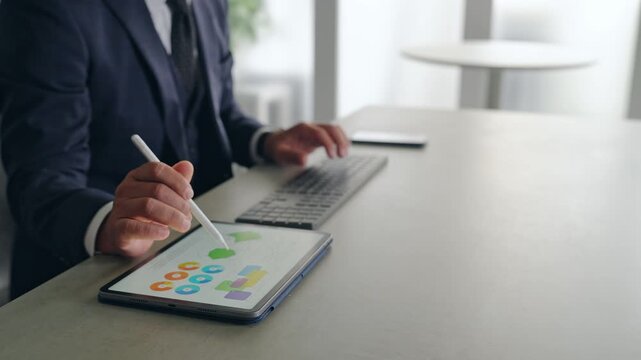 A male business professional interacting with a screen in mid-air. VR, virtual, operation, touch, office, business, development.