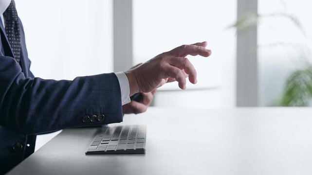 A male business professional interacting with a screen in mid-air. VR, virtual, hologram, operation, 3D image, office.
